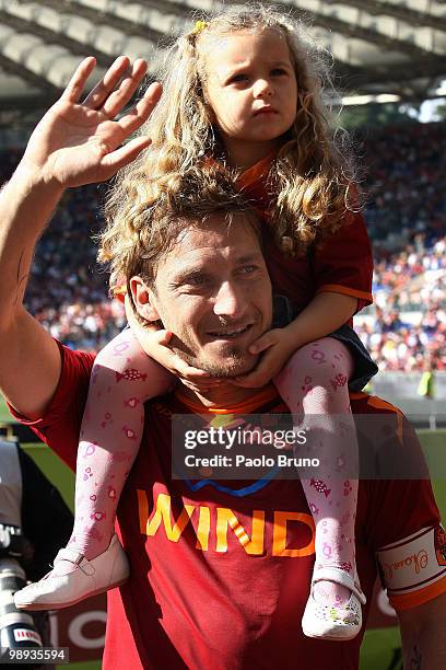 Francesco Totti of AS Roma, with his daughter Chanel on his shoulders, celebrates victory after the Serie A match between AS Roma and Cagliari Calcio...