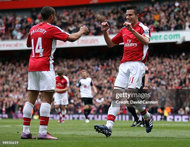 Robin Van Persie of Arsenal celebrates scoring Arsenal's second goal with Theo Walcott of Arsenal during the Barclays Premier League match between...