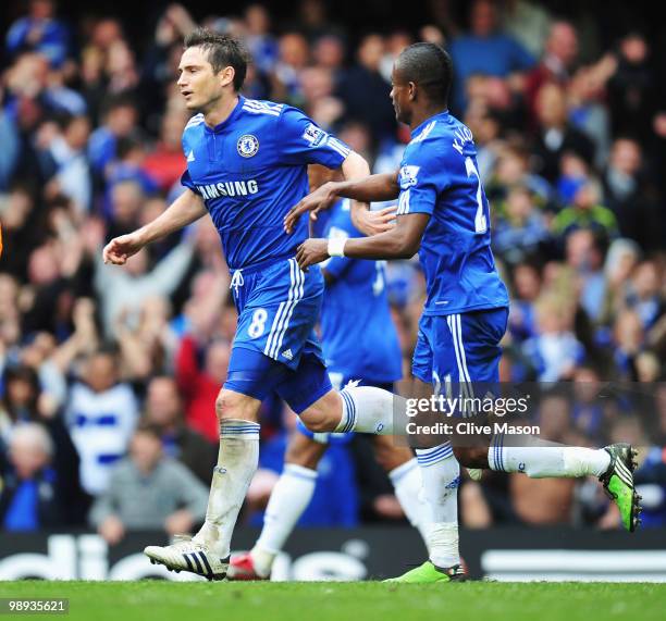 Frank Lampard of Chelsea celebrates with Salomon Kalou as he scores their second goal from a penalty during the Barclays Premier League match between...