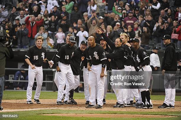 The White Sox gather at home plate to greet Alex Rios of the Chicago White Sox after Rios hit a walk-off, two-run home run against David Aardsma of...