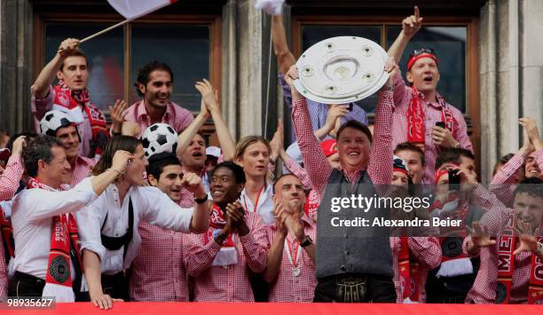 Head coach Louis van Gaal of Bayern Muenchen and his team celebrate their German championship title on the balcony of the town hall on May 9, 2010 in...