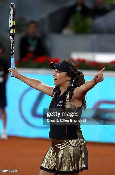 Aravane Rezai of France celebrates match point against Justin Henin of Belgium in their first round match during the Mutua Madrilena Madrid Open...