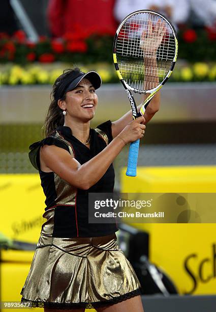 Aravane Rezai of France celebrates her victory against Justin Henin of Belgium in their first round match during the Mutua Madrilena Madrid Open...