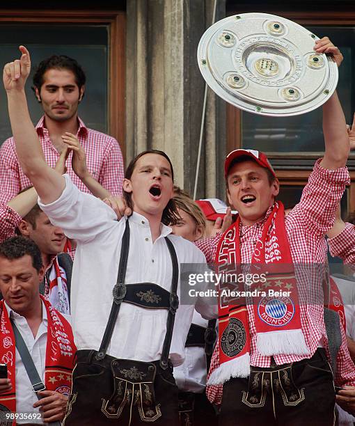 Goalkeeper Joerg Butt and Daniel van Buyten of Bayern Muenchen celebrate their German championship title on the balcony of the town hall on May 9,...