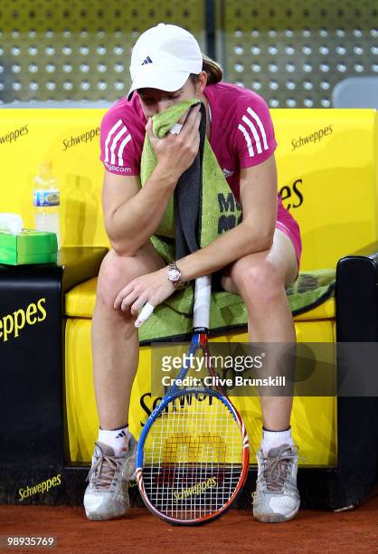 Justin Henin of Belgium shows her dejection against Aravane Rezai of France in their first round match during the Mutua Madrilena Madrid Open tennis...