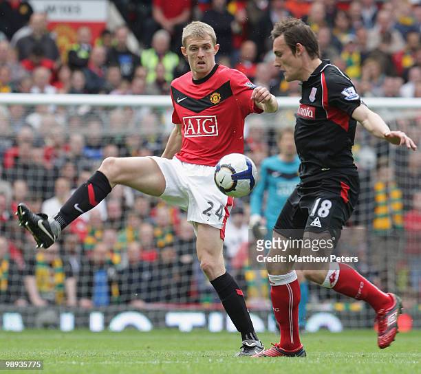 Darren Fletcher of Manchester United clashes with Dean Whitehead of Stoke City during the Barclays Premier League match between Manchester United and...