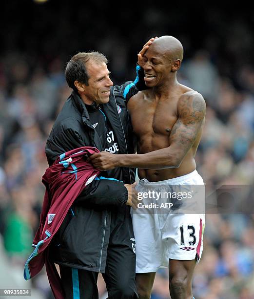 West Ham United's Portuguese player Luis Boa Morte celebrates scoring the opening goal with Italian manager Gianfranco Zola during the English...
