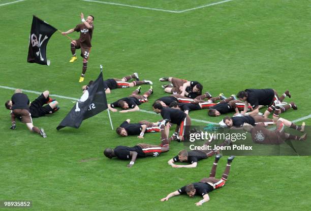 The team of St. Pauli celebrate after the Second Bundesliga match between FC St. Pauli and SC Paderborn at Millerntor stadium on May 9, 2010 in...