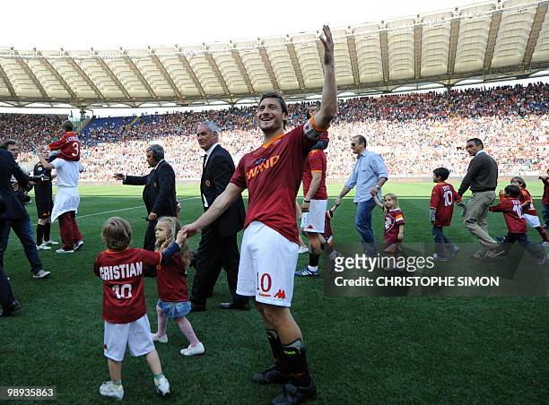 Roma's Captain Francesco Totti celebrates with his daughter Chanel and son Christian after his team's Italian Serie A football match against Cagliari...