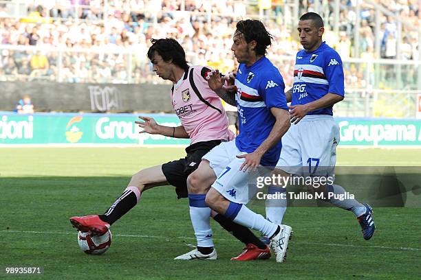 Javier Pastore of Palermo and Daniele Mannini of Sampdoria compete for the ball during the Serie A match between US Citta di Palermo and UC Sampdoria...