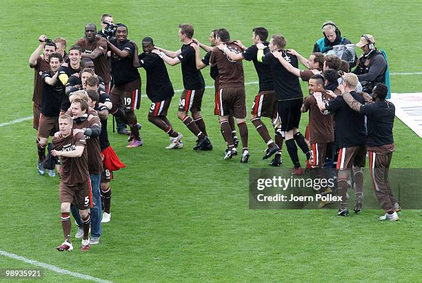 The team of St. Pauli celebrate after the Second Bundesliga match between FC St. Pauli and SC Paderborn at Millerntor stadium on May 9, 2010 in...