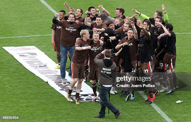 The team of St. Pauli celebrate after the Second Bundesliga match between FC St. Pauli and SC Paderborn at Millerntor stadium on May 9, 2010 in...