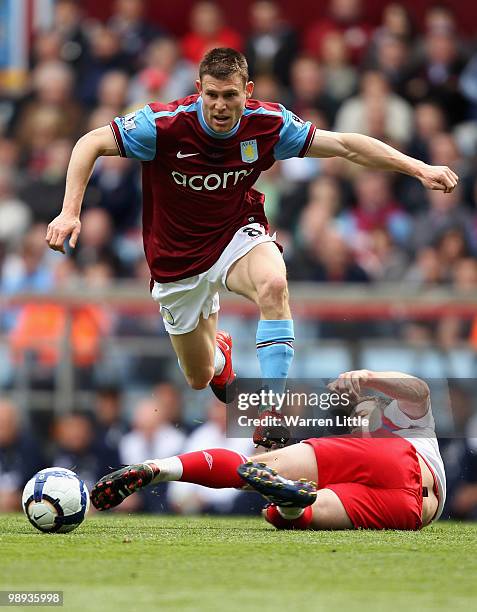 James Milner of Aston Villa is tackled by David Dunn of Blackburn Rovers during the Barclays Premier League match between Aston Villa and Blackburn...