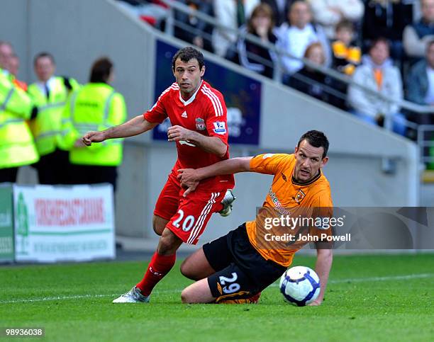 Javier Mascherano of Liverpool competes with Jan Vennegoor of Hesselink of Hull City during the Barclays Premier League match between Hull City and...