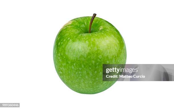 green granny smith apple on white background - granny smith stock pictures, royalty-free photos & images