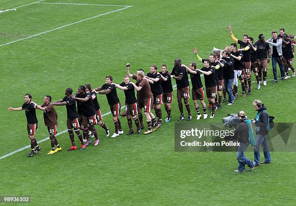 The team of St. Pauli celebrate after the Second Bundesliga match between FC St. Pauli and SC Paderborn at Millerntor stadium on May 9, 2010 in...