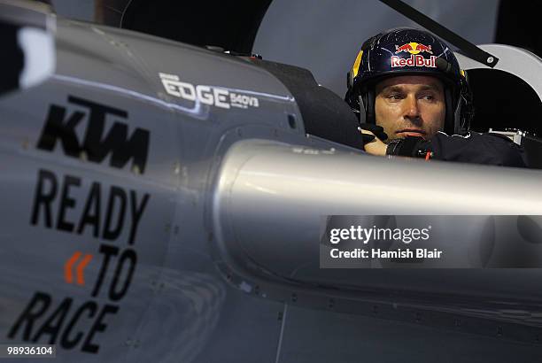 Hannes Arch of Austria looks on as bad weather delays his flight during the Red Bull Air Race Day at the Race Airport on May 9, 2010 in Rio de...