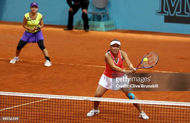 Yung-Jan Chan of Taipei and Jie Zheng of China in action against Cara Black of Zimbabwe and Elena Vesnina of Russia in their first round doubles...
