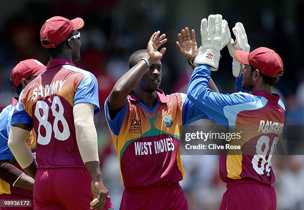 Kemar Roach of West Indies celebrates the wicket of Gautam Gambhir of India during the ICC World Twenty20 Super Eight match between West Indies and...