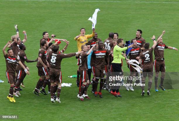 The team of St. Pauli celebrate after the Second Bundesliga match between FC St. Pauli and SC Paderborn at Millerntor stadium on May 9, 2010 in...