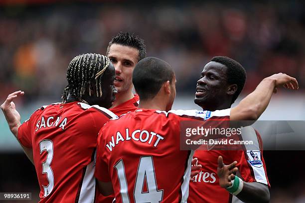 Theo Walcott, Bacary Sagna, Robin Van Persie and Emmanuel Eboue of Arsenal celebrate Arsenal's third goal during the Barclays Premier League match...