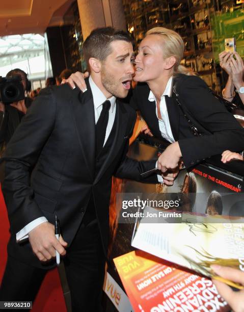 Actor Jake Gyllenhaal is kissed by a fan as he attends the 'Prince Of Persia: The Sands Of Time' world premiere at the Vue Westfield on May 9, 2010...