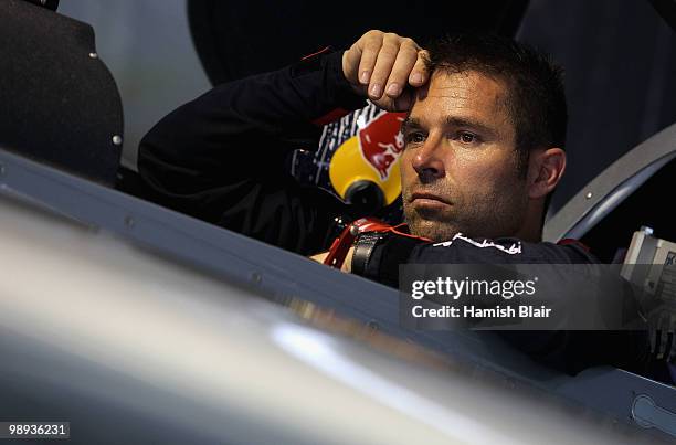 Hannes Arch of Austria looks on as bad weather delays his flight during the Red Bull Air Race Day at the Race Airport on May 9, 2010 in Rio de...