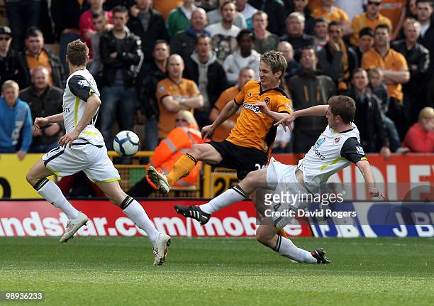 Kevin Doyle of Wolves beats Michael Turner to the ball during the Barclays Premier match between Wolverhampton Wanderers and Sunderland at Molineaux...