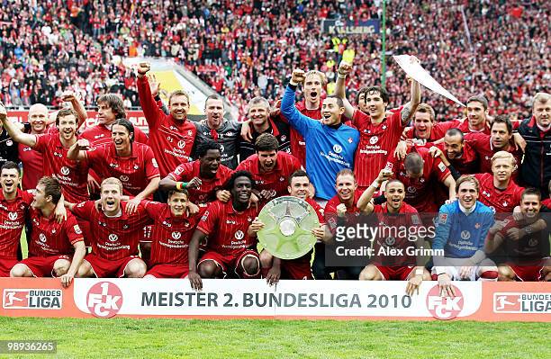 Player of Kaiserslautern pose with the championship trophy after the Second Bundesliga match between 1. FC Kaiserslautern and FC Augsburg at the...