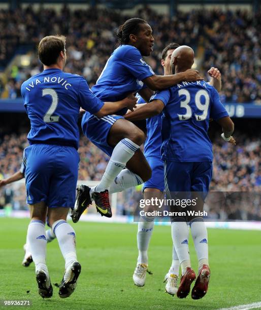 Nicolas Anelka of Chelsea is congratulated by teammates after scoring the opening goal during the Barclays Premier League match between Chelsea and...