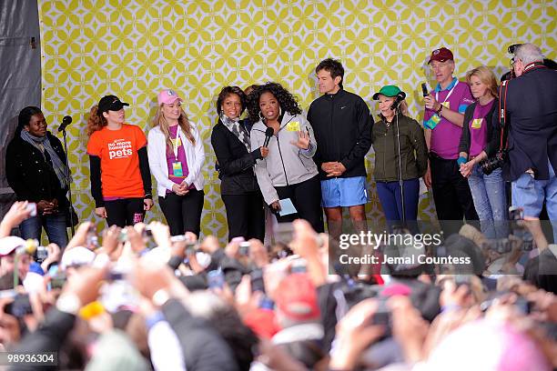 Media personality Sade Baderinwa and media personality Oprah Winfrey onstage at the completion of the "Live Your Best Life Walk" to celebrate O, The...