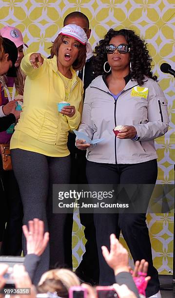 Media personalities Gayle King and Oprah Winfrey onstage at the completion of the "Live Your Best Life Walk" to celebrate O, The Oprah Magazine's...