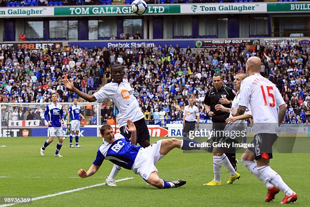 Birmingham City's Gregory Vignal is fouled by Bolton Wanderers's Fabrice Muamba during the Barclays Premier League match between Bolton Wanderers and...