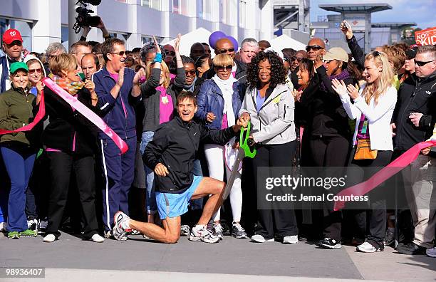 Media personality and physician Dr. Mehmet Oz and media personality Oprah Winfrey cut the ribbon to signal the start of the "Live Your Best Life...