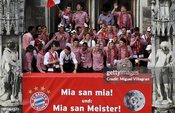 The player of Bayern Muenchen present the German championship trophy on the balcony of the town hall during the champions party on the Marienplatz on...