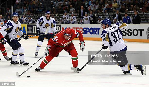 Mikhail Grabovski of Belarus and Evgeni Fadeyev of Kazakhstan battle for the puck during the IIHF World Championship group A match between Slovakia...
