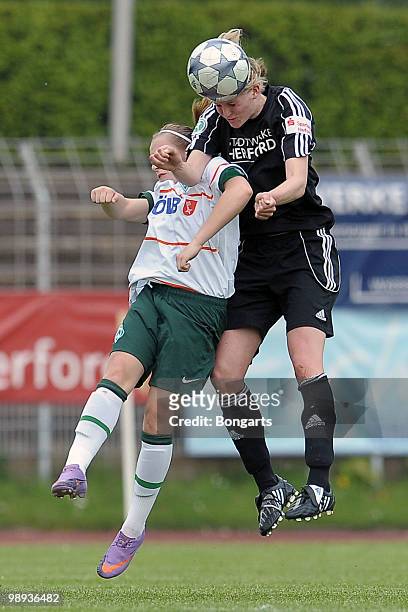 Antje Koenig of Bremen and Christina Schulte of Herford jump for a header during the Women's Second Bundesliga match between Herforder SV and Werder...