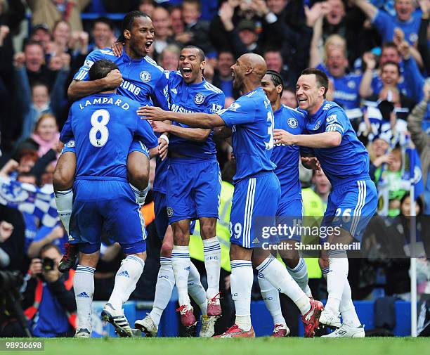 Didier Drogba of Chelsea celebrates with team mates as he scores their fifth goal during the Barclays Premier League match between Chelsea and Wigan...