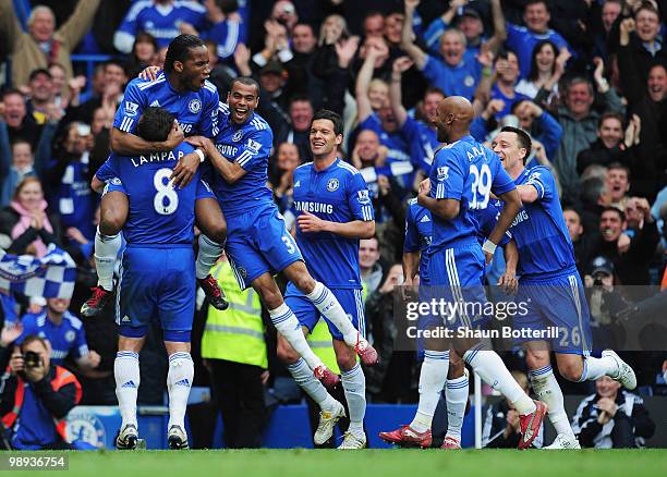 Didier Drogba of Chelsea celebrates with team mates as he scores their fifth goal during the Barclays Premier League match between Chelsea and Wigan...