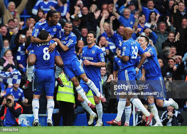 Didier Drogba of Chelsea celebrates with team mates as he scores their fifth goal during the Barclays Premier League match between Chelsea and Wigan...