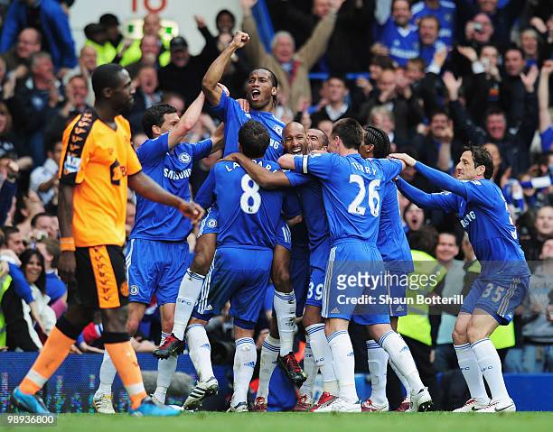 Didier Drogba of Chelsea celebrates with team mates as he scores their fifh goal during the Barclays Premier League match between Chelsea and Wigan...