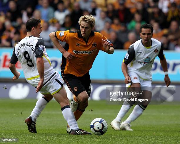 Kevin Doyle of Wolves moves past Steed Malbranque during the Barclays Premier match between Wolverhampton Wanderers and Sunderland at Molineaux on...