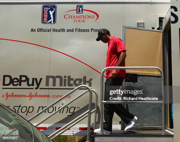 Tiger Woods walks out of the physio truck after withdrawing from the tournament on the seventh hole with a neck injury during the final round of THE...