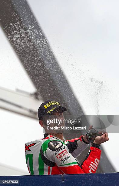 Max Biaggi of Italy and Aprilia Alitalia Racing celebrates on the podium the victory at the end of the Race Two of the Supersbike World Championship...