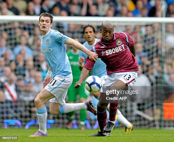 West Ham United's Portuguese player Luis Boa Morte vies with Manchester City's English midfielder Adam Johnson during the English Premier League...