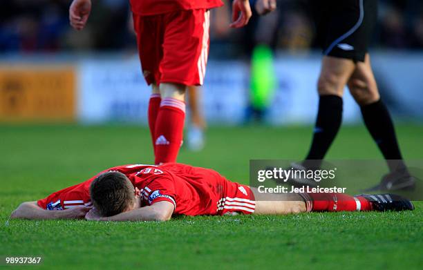 Steven Gerrard of Liverpool lies on the pitch after his shot hit the post in the last few minutes of the 0-0 game during the Barclays Premier League...