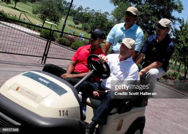 Tiger Woods is driven off the golf course to the clubhouse by Joe Corless, the head of PGA TOUR security after Tiger withdraws on the seventh hole...