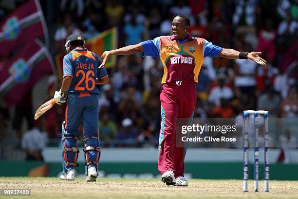 Dwayne Bravo of West Indies celebrates at the end of the ICC World Twenty20 Super Eight match between West Indies and India at the Kensington Oval on...