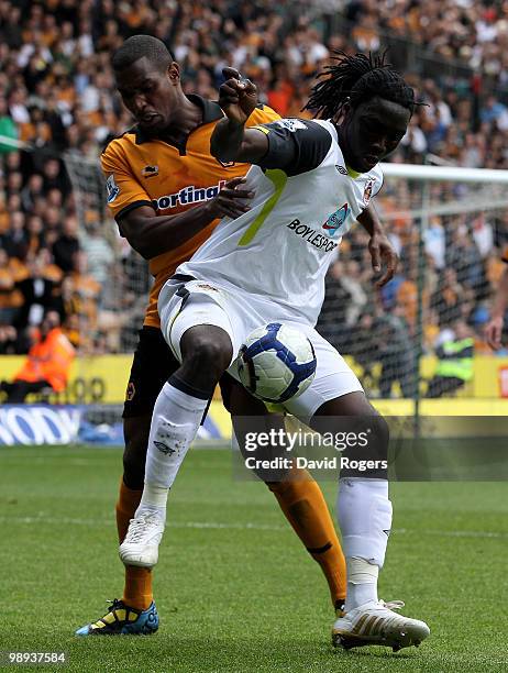 Ronald Zubar of Wolves challenges Kenwyne Jones during the Barclays Premier match between Wolverhampton Wanderers and Sunderland at Molineaux on May...