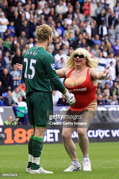 Birmingham City fan approaches Birmingham City's Joe Hart during the Barclays Premier League match between Bolton Wanderers and Birmingham City at...